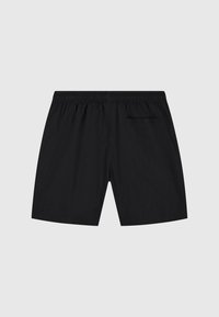 Schwarze Shorts aus leichtem Material mit einem elastischen Bund, ausgestattet mit einer einzelnen Gesäßtasche und einer glatten Textur.