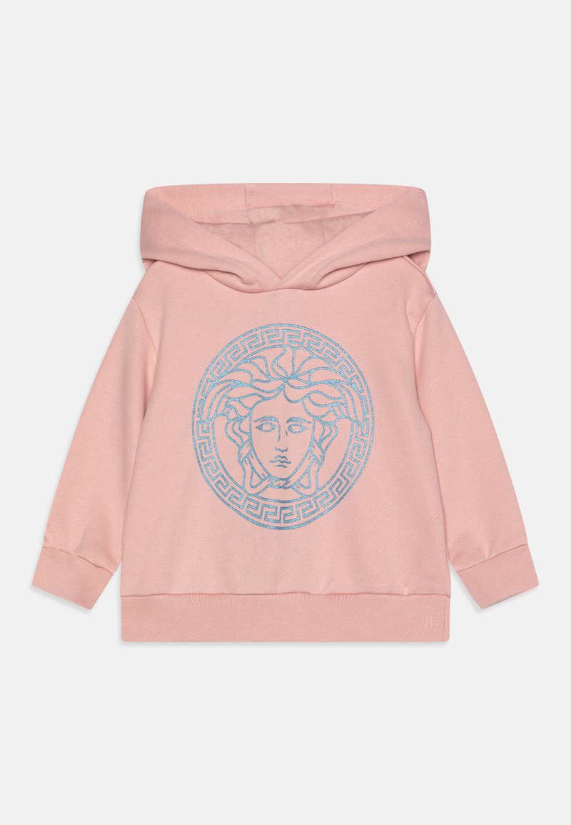 Lyserød hoodie med et rundt Medusa-grafik i blå, omgivet af et græske nøglemønster. Fremstillet af blødt stof med et hyggeligt design.