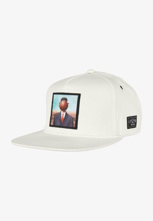 White snapback cap featuring a graphic patch of a suited figure with a basketball for a head, set against a blue and landscape background.