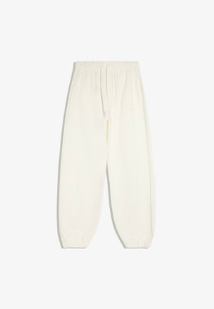 Pantalon jogger écru avec taille élastique, cordon de serrage et poignets élastiques, présenté sur un fond blanc uni.