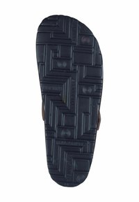Schwarzer Gummisandalen-Sohle mit strukturiertem Profil, das geometrische Muster und runde Akzente aufweist. Enthält den Markenname imprägniert.