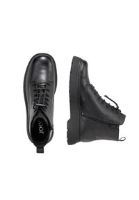 Mustad mustad nahast ankle boots ümarate varvastega, paeltega ees, ühepoolne nõel sulgemiseks ja tekstureeritud kummitald.