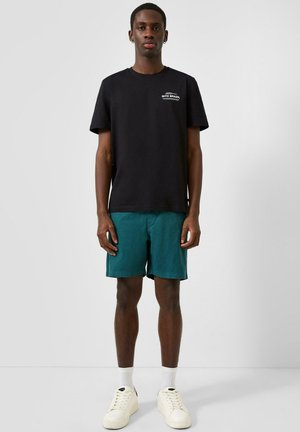 QS BERMUDA - Jogginghose - petrol
