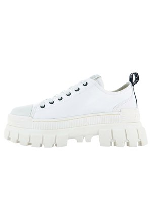 White low-top sneaker with chunky lug sole, black eyelets, white laces, and a black pull tab at the heel.