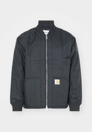 Black quilted jacket with a zip front, ribbed cuffs, and a stand collar. Features two side pockets and a small logo patch on the pocket.