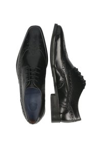 Scarpe eleganti da uomo in pelle nera con dettagli brogue, punta appuntita e tacco basso. Presentano lacci e una finitura lucida.