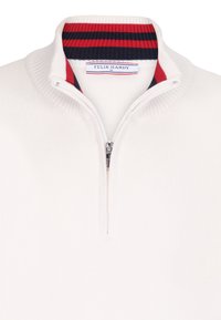 Valge tõmblukuga sviiter soonikkuhu ja punaste ning tumesiniste triipudega. Valmistatud tekstureeritud kudumaterjalist. Brändi silt on nähtav.