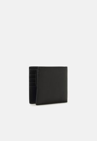 Black leather wallet featuring a textured surface, multiple card slots, and a folding design, viewed from a slightly angled side.