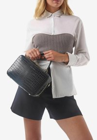 Miriade SOLANA - Borsa a mano - nero