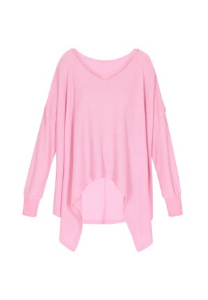Lichtroze wafeltricot top met een losse pasvorm, V-hals, verlaagde schouders en lange mouwen. Heeft een gebogen, hoge-lage zoom.