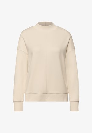 Beige sweatshirt med hög krage, sänkta axlar och ribbade muddar. Mjukt, slätt tyg utan synliga mönster eller metalldetaljer.