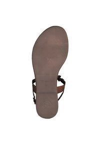 Semelle de sandale marron avec caoutchouc texturé pour plus d'adhérence, présentant une forme courbée et la marque "Tamaris 37" près du talon.