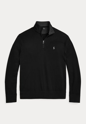 Črn pulover s polo zip ovratnikom. Narejen iz mehkega blaga, ima sivo notranjo ovratnico in majhen logo na prsih.