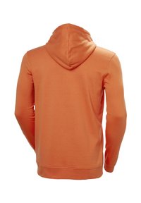 Sudadera naranja, material de algodón suave, cuenta con una capucha con cordón, mangas largas y puños y dobladillo acanalados. Textura suave con un corte relajado.