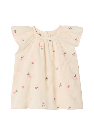 Cream-colored toddler blouse with flutter sleeves and small pink and red floral embroidery scattered across the fabric.