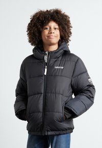 Levi's® CORE PUFFER - Vinterjacka - black