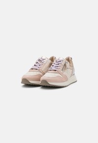 Light pink sneakers with quilted fabric and smooth leather accents. Features purple laces and a side zipper for easy access. Flat soles.
