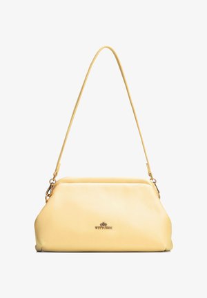 Zachte gele leren handtas met een enkele schouderband en goudkleurige metalen gespjes, met een klein "WITTCHEN"-logo aan de voorkant.