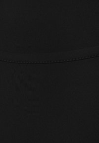 Black stretchy fabric with a ribbed texture, featuring a smooth waistband and minimal stitching details. Suitable for active wear.