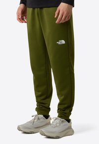 The North Face M REAXION FLEECE JOGGER - EU - Trainingsbroek - woodland green