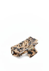 Fermaglio per capelli tartaruga in plastica beige e nera, con un design rettangolare, meccanismo a scatto e bordi ondulati per una migliore presa.