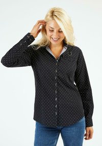 Chemise noire à boutons avec des pois blancs, manches longues, col, poche avant et un col intérieur de couleur gris clair contrastant.