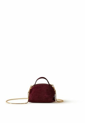 Small rounded dark red textured handbag with a short handle and a long thin gold chain strap on a white background.