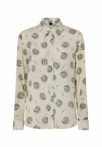 Blusa crema con motivi a spirale neri. Maniche lunghe, colletto classico, chiusura frontale con bottoni e orlo dritto con dettagli ai polsini.