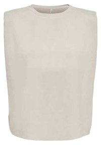 Beige ärmlös topp med rund halsringning, slät textur och lös passform. Kanterna är något krökta vid fållen för en extra design.