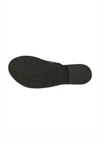 Semelle de chaussure en caoutchouc noir avec des rainures horizontales et verticales pour l'accroche, présentant une forme plate et large ainsi qu'une texture lisse et mate.