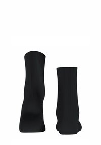 Schwarze gerippte Socken mit einer glatten Textur, in mittlerer Wadenhöhe und nahtlosem Design. Keine sichtbaren Logos oder Muster.