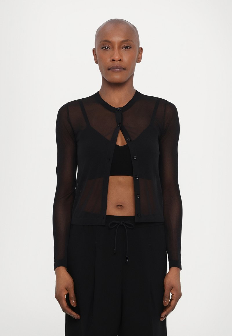 Black sheer cardigan with long sleeves, button closure, and a fitted silhouette, layered over a black top. Smooth texture, minimalist design.