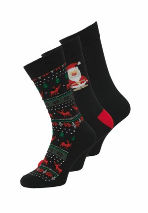 Drie zwarte scheenlappen: één met patroon van rode rendieren en groene bomen, één met de kerstman, en één effen met een rode hielstuk.