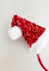 Red sequin Santa hat with white faux fur trim and pom-pom. The hat has a conical shape and a glossy, textured appearance.