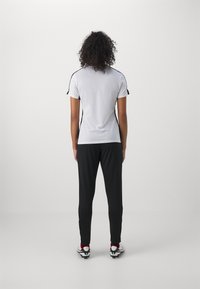 Nike Performance ACADEMY PANTS - Treningo apatinė dalis - black/metallic gold