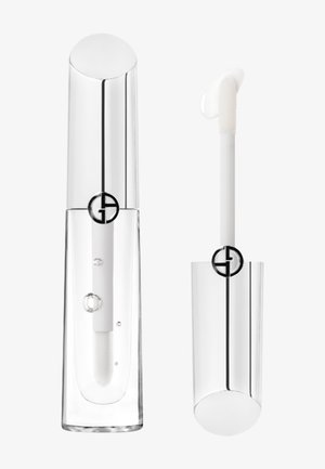 Clear lip gloss container with a glossy silver cap, featuring a transparent body and a white applicator wand. Black logo detail visible.