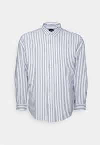 Nappikauluksellinen paita valkoisissa ja vaaleansinisissä pystysuorissa raidoissa, pitkät hihat, yksittäinen rintatasku ja klassinen kaulussuunnittelu. Puuvillakangas.