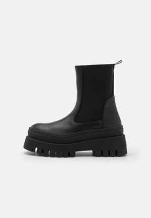CASSANDRA - Platform ankle boots - black