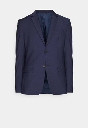 Marineblå blazer med to-knaps lukning, udskårne revers og sidelommer. Glat stof, delvist foret indre og skræddersyet pasform.
