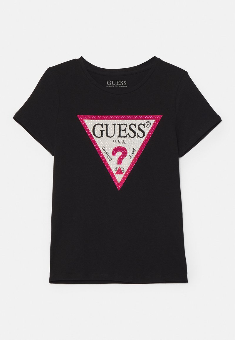 Schwarzes kurzärmliges T-Shirt aus Bio-Baumwolle. Mit einem dreieckigen Grafikdesign, dem "GUESS"-Logo, pinkem Rand und verziertem Fragezeichen.