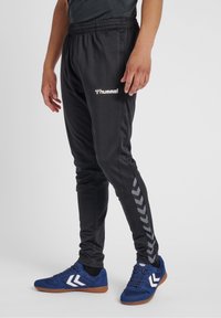 Hummel Teplákové kalhoty - black