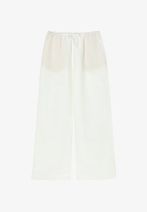 Valged vabaltlangevad püksid, millel on nöörivöö ja poolläbipaistev ülemine osa. Valmistatud kergest kangast, millel on sile tekstuur.