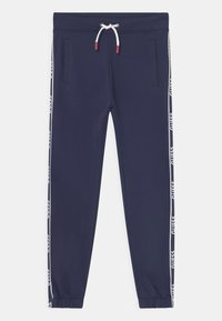Marineblauwe sweatpants van zachte stof, met zijzakken, elastische boorden en een tailleband met trekkoord met contrasterende logostrepen.