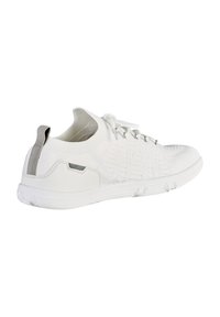 White athletic shoe with a knitted upper, textured patterns, and a grey accent on the heel tab. Features a flexible rubber sole.