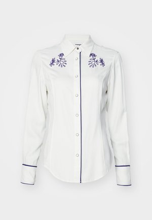 Garais piedurkņu baltais krekls, izgatavots no auduma, ar purpura ziedu izšuvumiem uz apkakles un piedurknēm, ar pogu aizdari un kontrastējošu apdari.