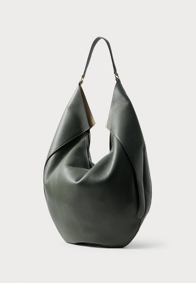 Green leather handbag with a slouchy design, featuring a single shoulder strap and a smooth texture. Notable folded accents at the opening.