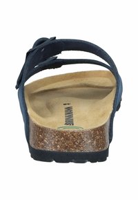 Blue leather slide sandal with a cork footbed, adjustable strap, flat sole, and textured rubber bottom for grip.