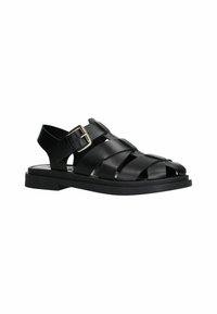 Sandales en cuir noir avec des bretelles croisées, bout ouvert et boucle à la cheville. Semelle plate avec un fond texturé pour une meilleure adhérence. Design simple et fonctionnel.