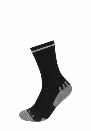 Schwarze Socken mit gerippter Textur, grauen Verstärkungen an Ferse und Zehen sowie einem kontrastierenden weißen Streifen am Bündchen. Markenlogo auf dem Fuß sichtbar.