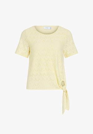 Hele kollase lühikeste varrukatega top pitsiliste aukudega ja külgmise sõlme detailiga ääres, ümar kaelus.